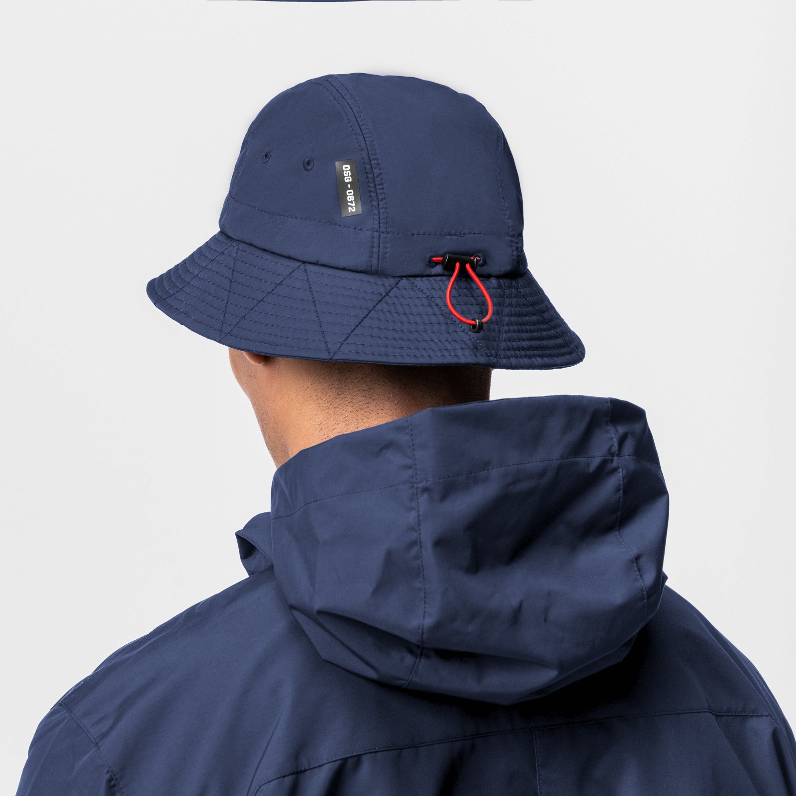 0672 Hipora® Bucket Hat in Navy worn by model, back view