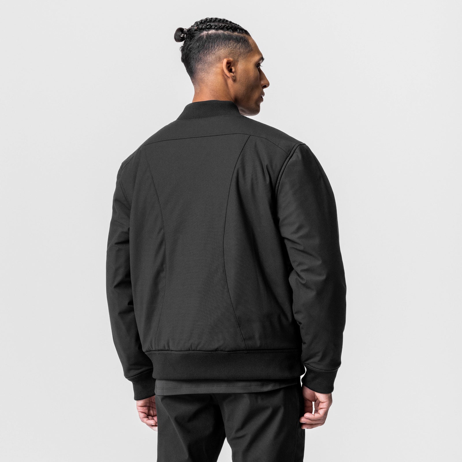 Kinterra Weatherproof Bomber Jacket in black, worn by model shown from back