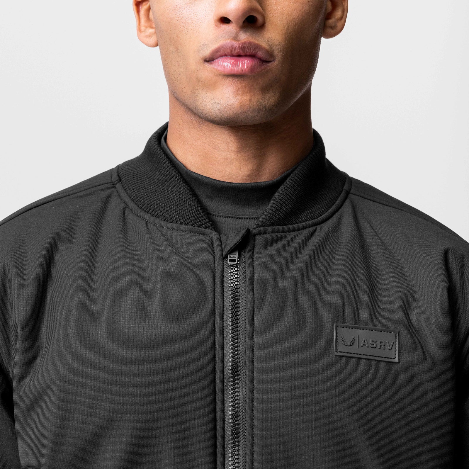 Kinterra Weatherproof Bomber Jacket in black, worn by model, front view