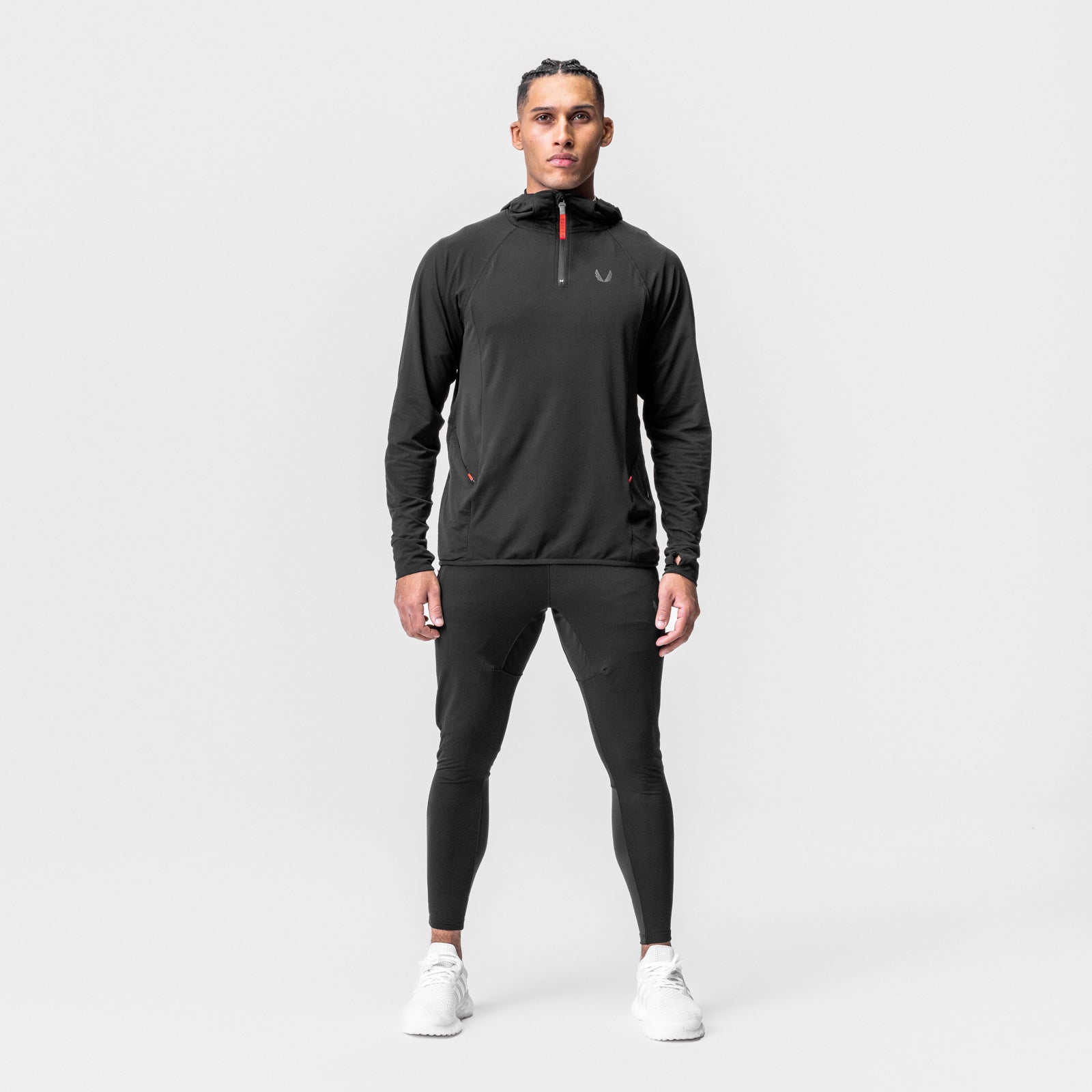 Black Training Hoodie worn by male model with matching black leggings, front view