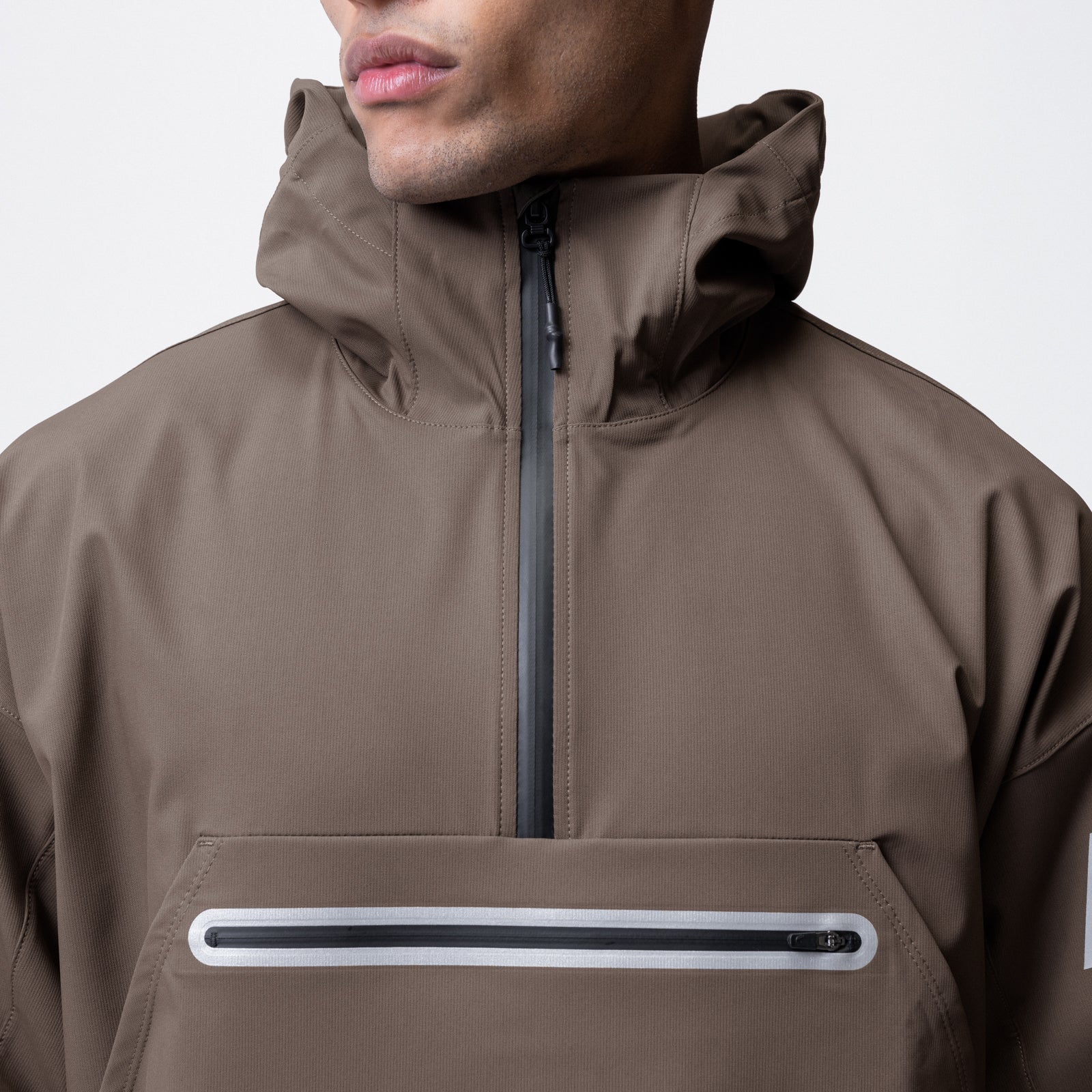 Weather-Ready Anorak Jacket in deep taupe worn by model, front view with hood up