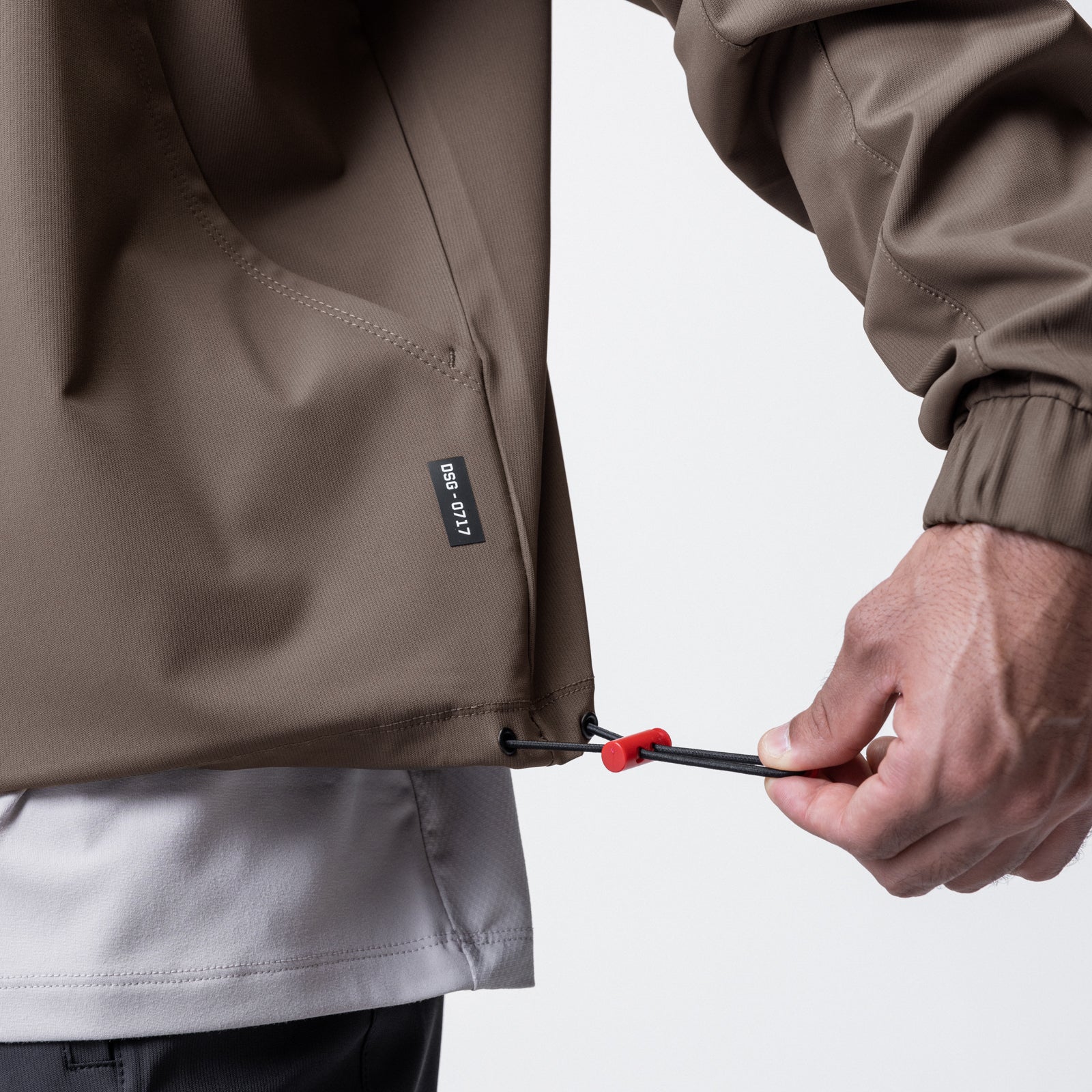 Weather-Ready Anorak Jacket in Deep Taupe, model demonstrating adjustable drawstring detail