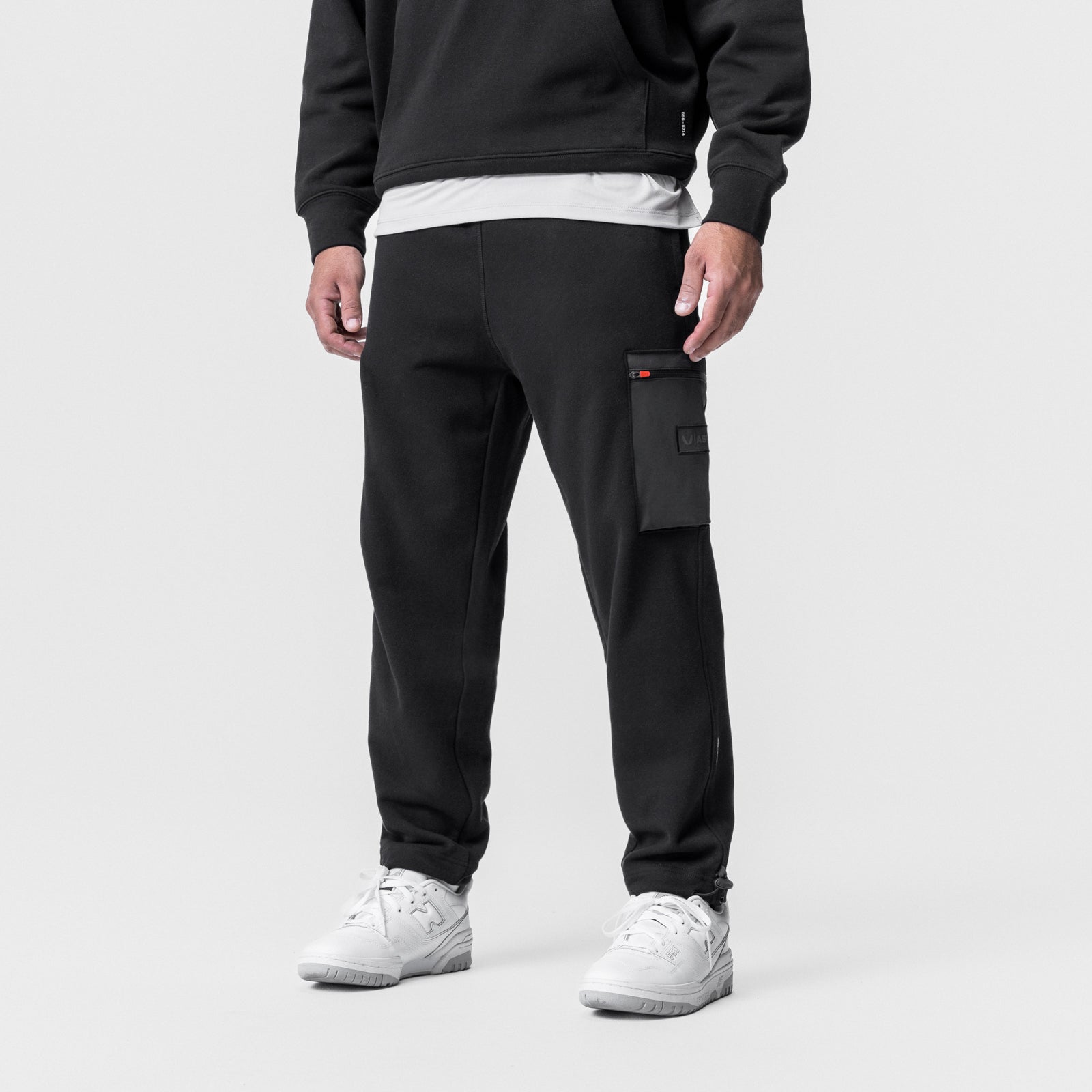 Tech-Terry Cinch Cargo Jogger in black worn by model, back view