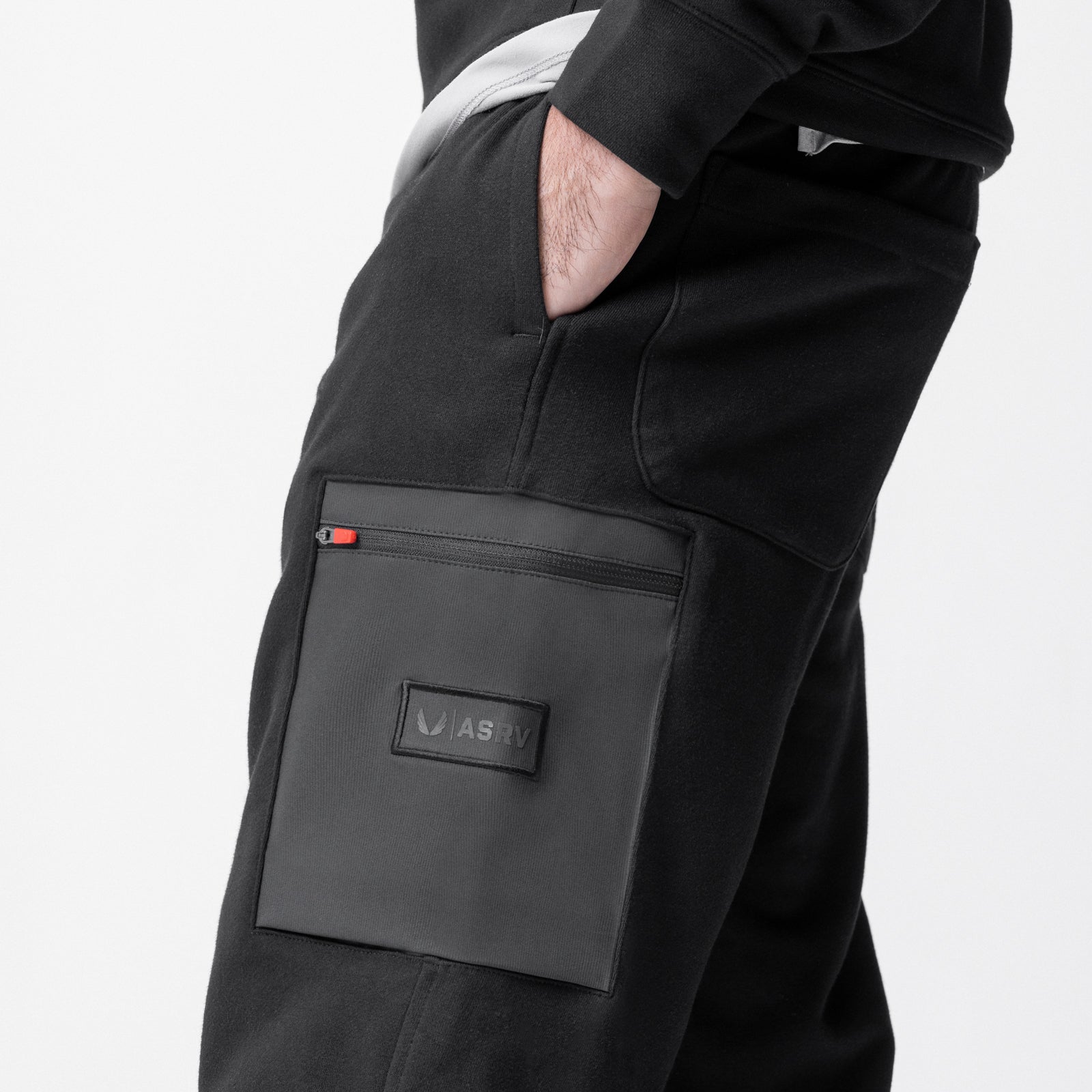 Tech-Terry Cinch Cargo Jogger in black worn by model, side view showing cargo pocket detail