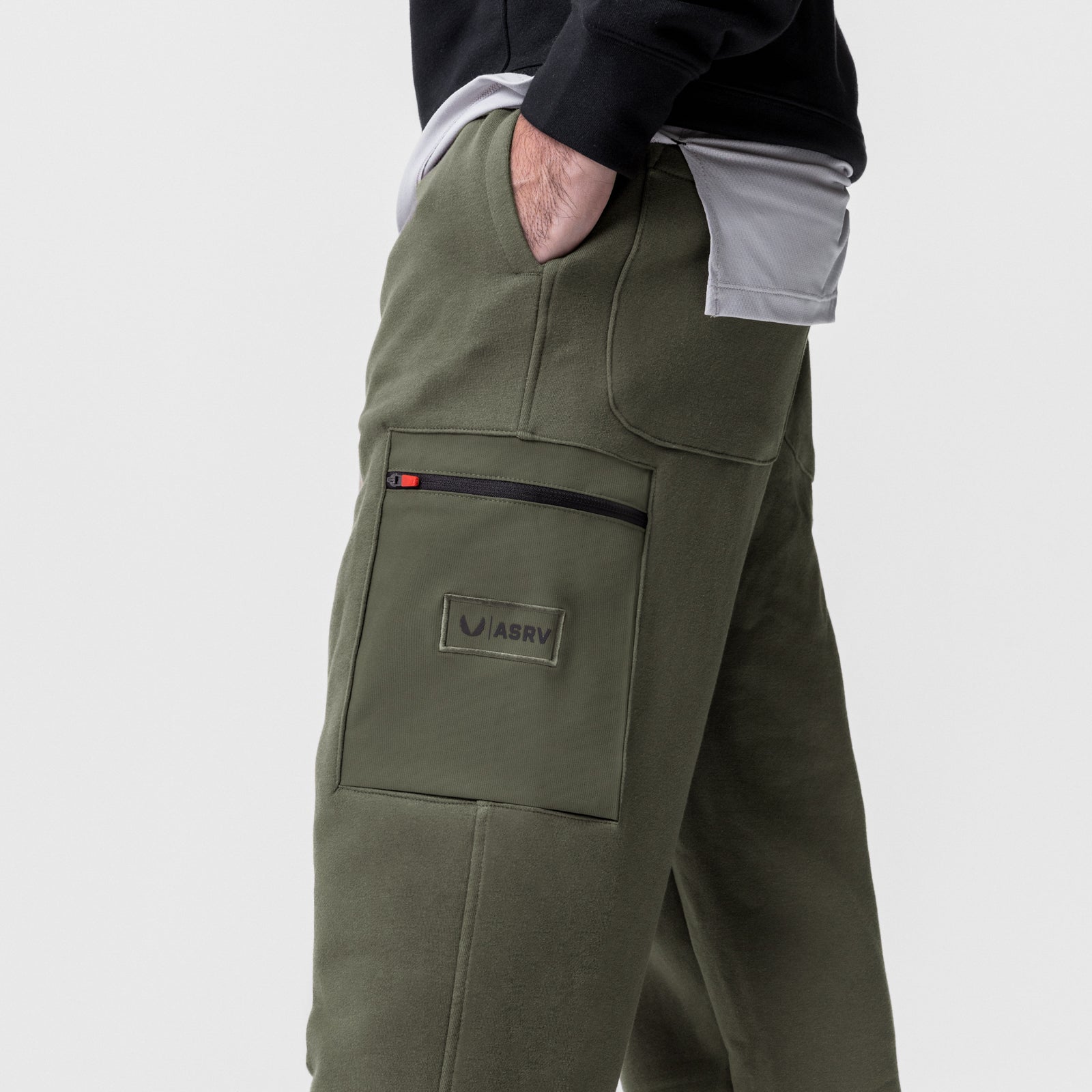 Tech-Terry Cinch Cargo Jogger in olive worn by model, side view showing cargo pocket