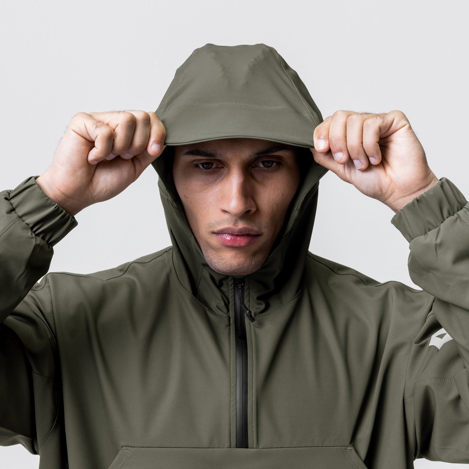 Weather-Ready Anorak Jacket in olive, model wearing and adjusting hood