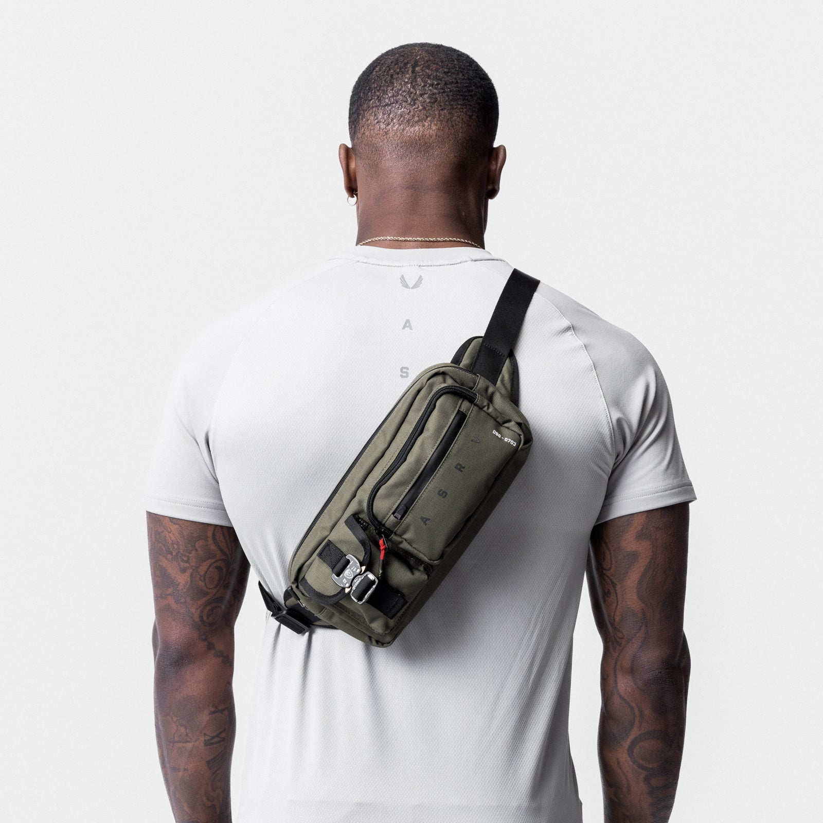 0703 Cordura Tech Crossbody Pack in Olive, worn across back of model