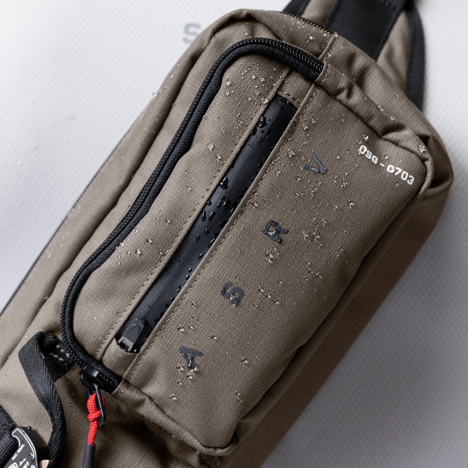 0703 Cordura Tech Crossbody Pack in Deep Taupe, worn across body