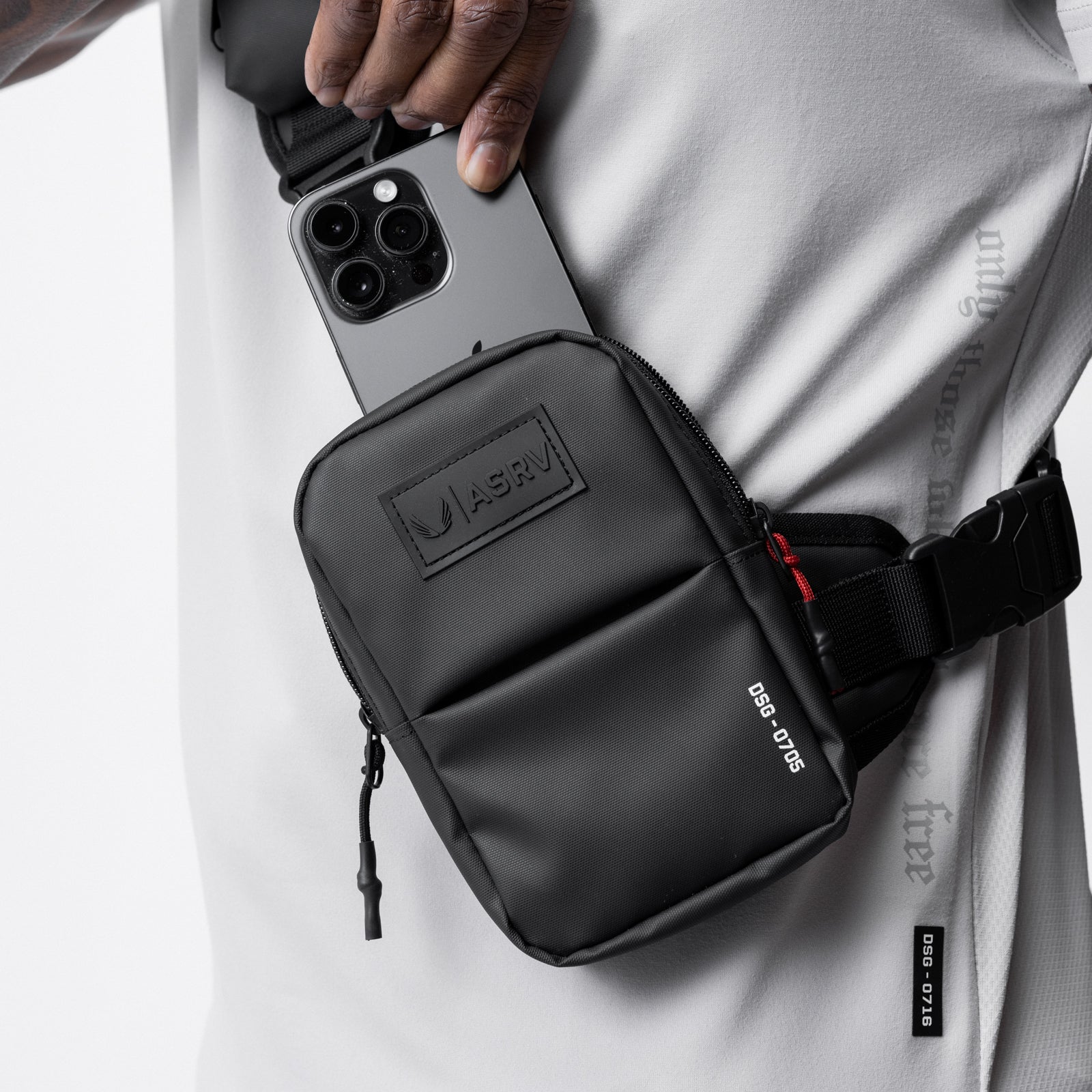 0705 Waterproof Holster Sling Bag in black, worn across chest with phone held above