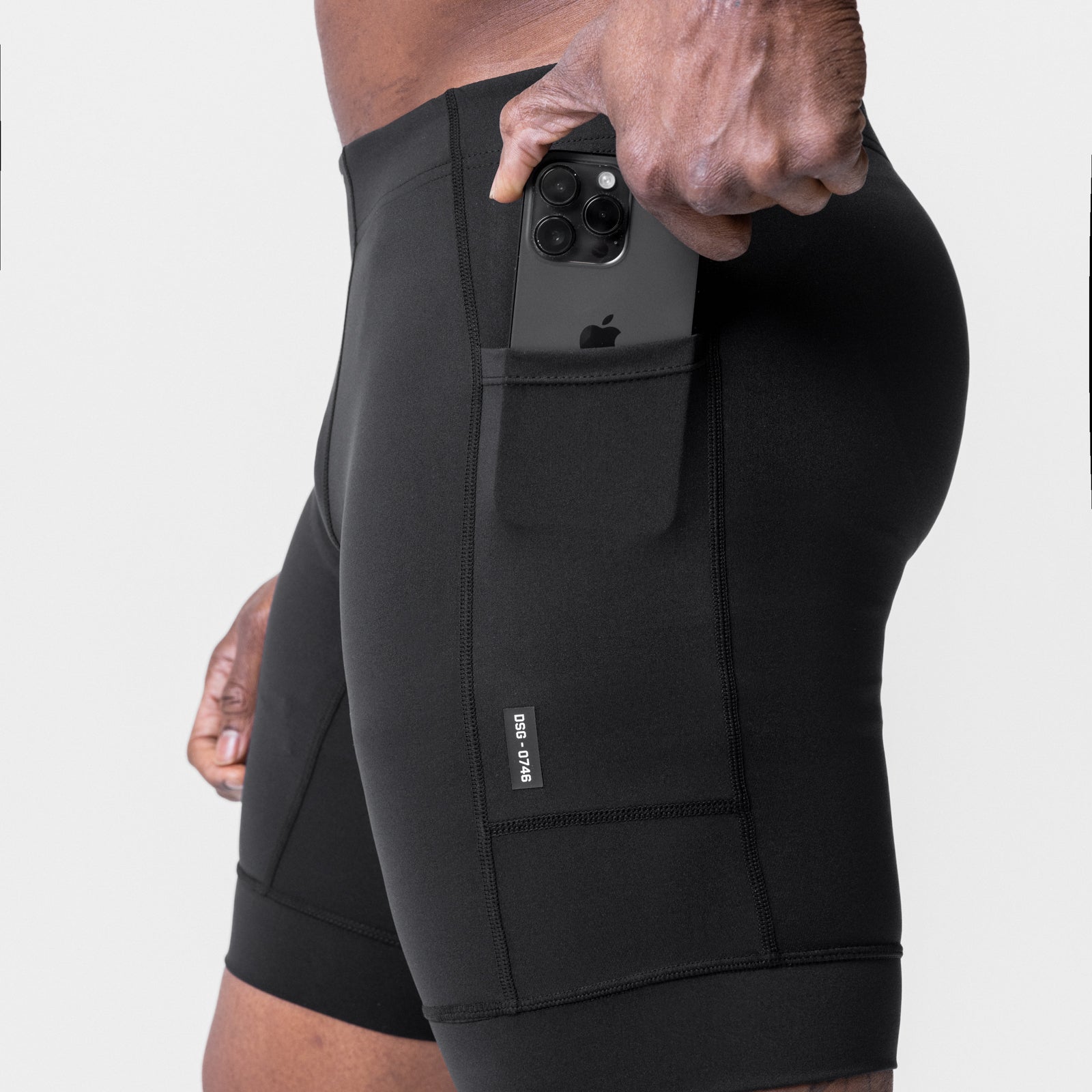 WarpFlexx® Side Pocket 1/2-Length Legging in black, model holding smartphone in side pocket