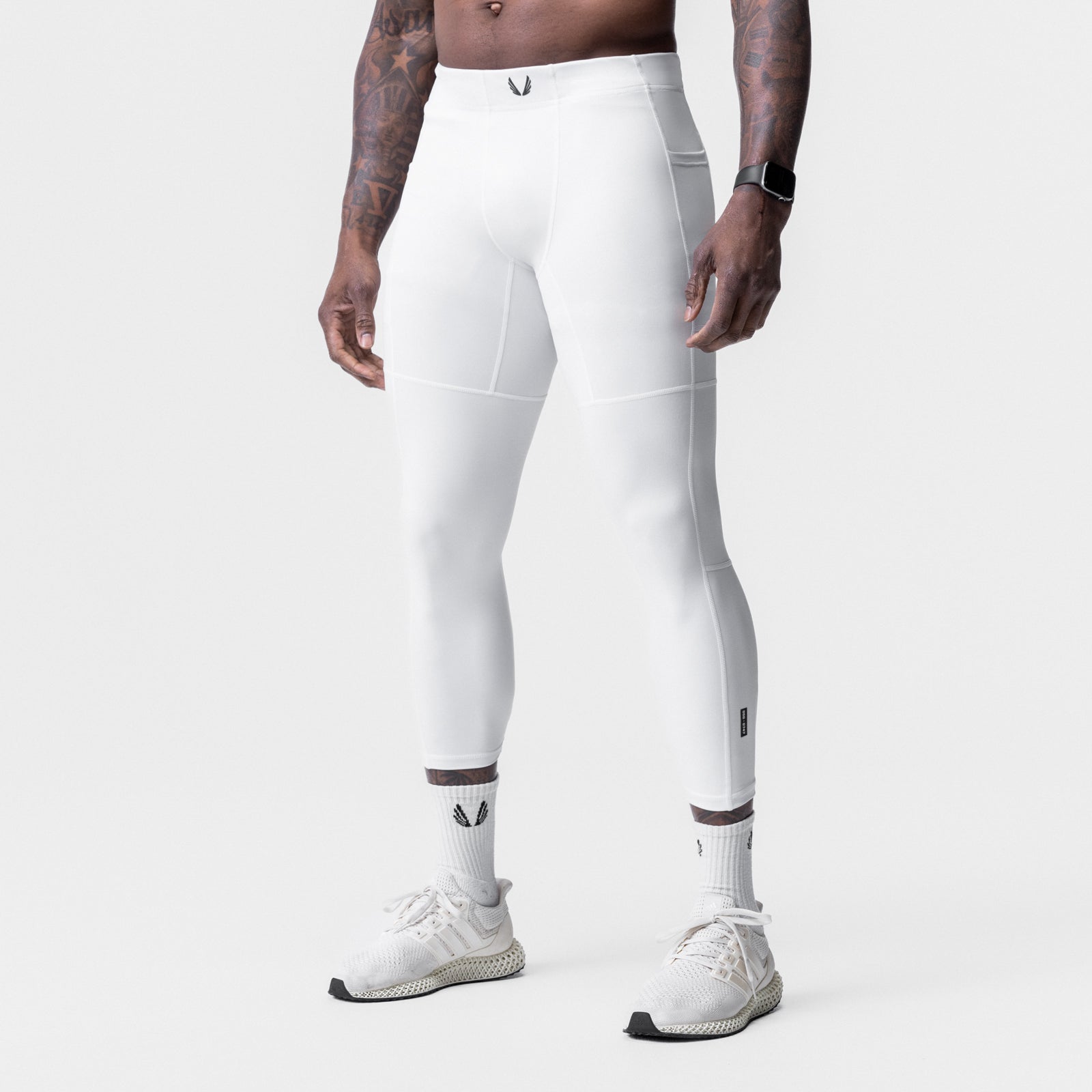 White WarpFlexx Side Pocket 3/4-Length Legging worn by model, side view