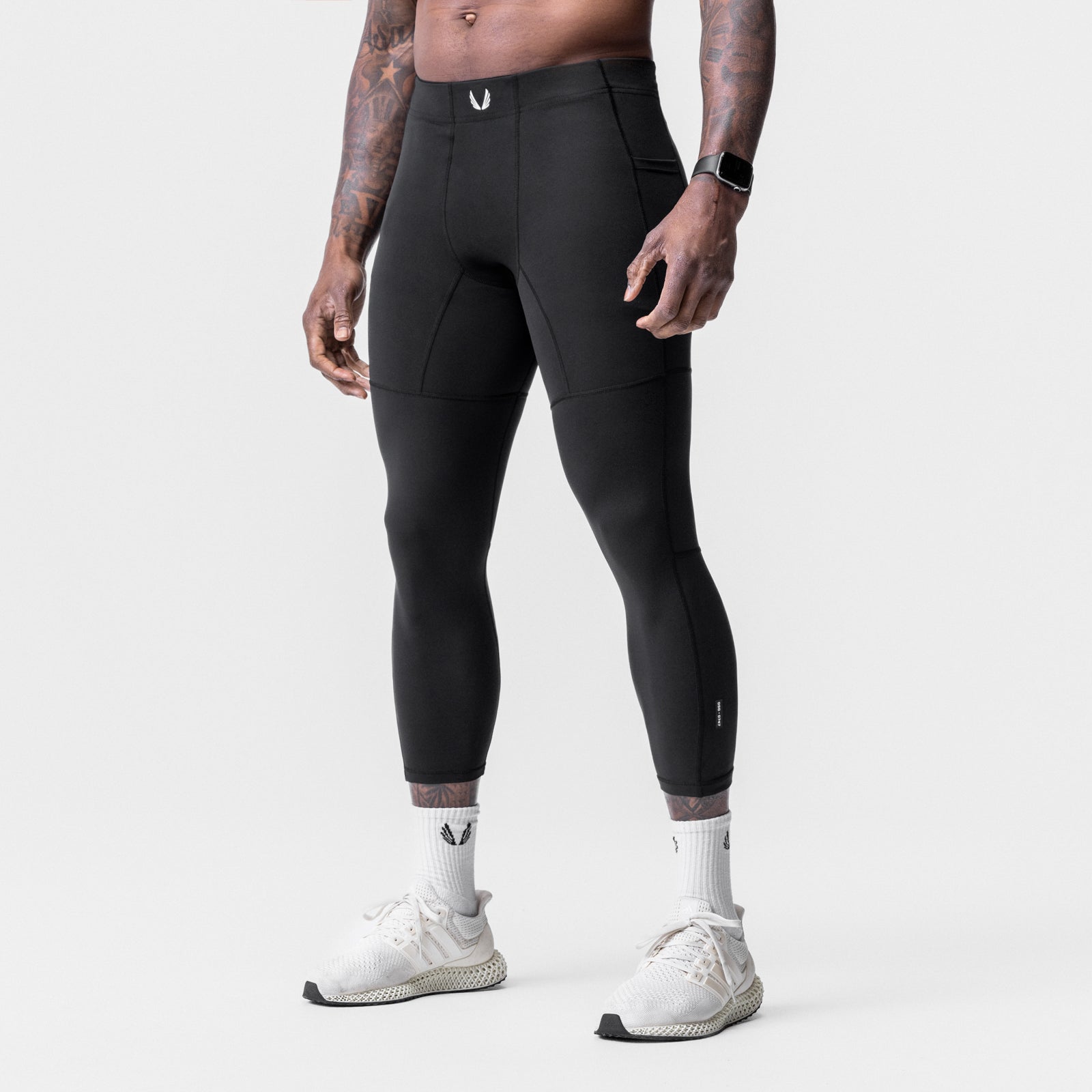 WarpFlexx® Side Pocket 3/4-Length Legging in black, worn by model, rear view