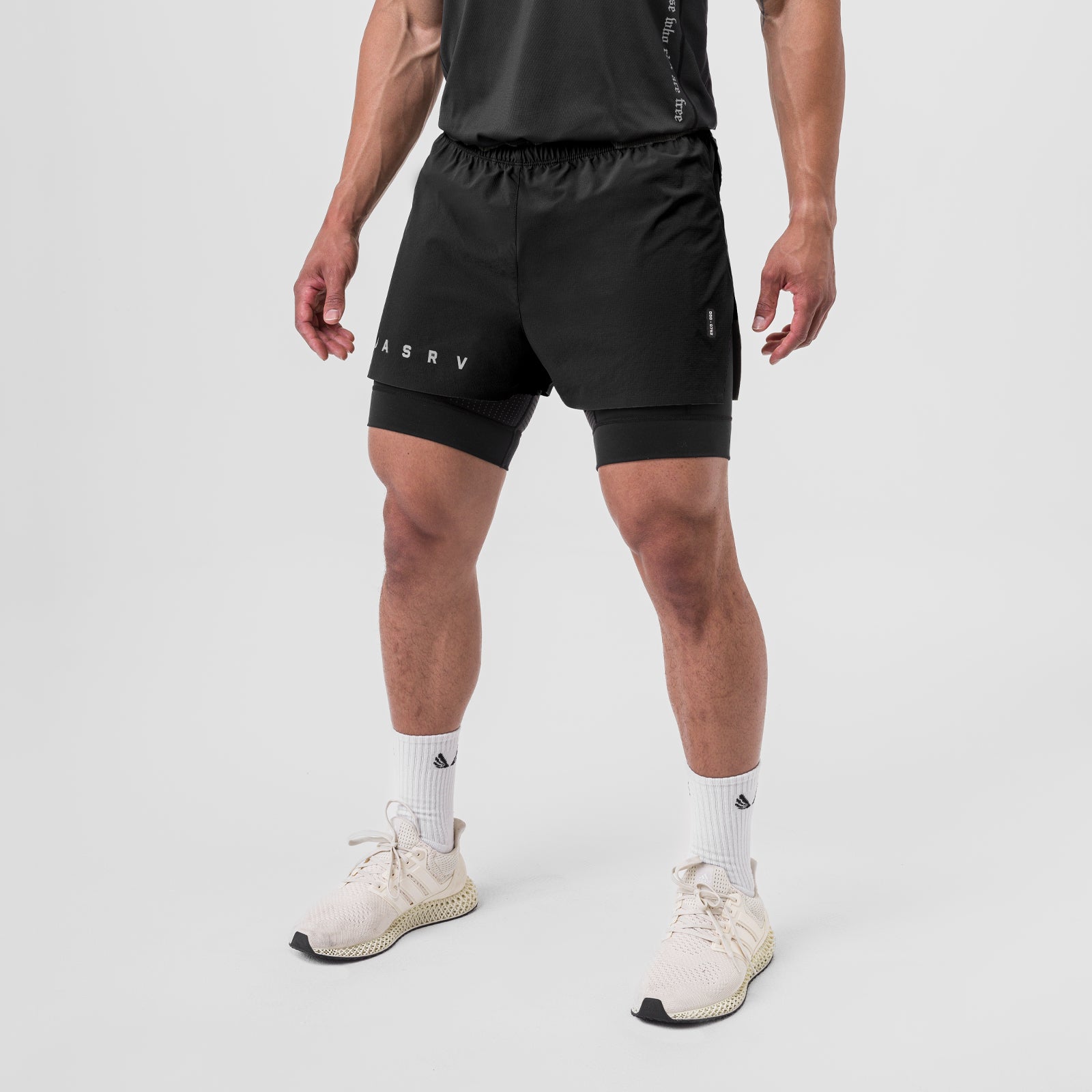 Ripstop 3" High Split Liner Short in black, worn by model with white socks and cream sneakers