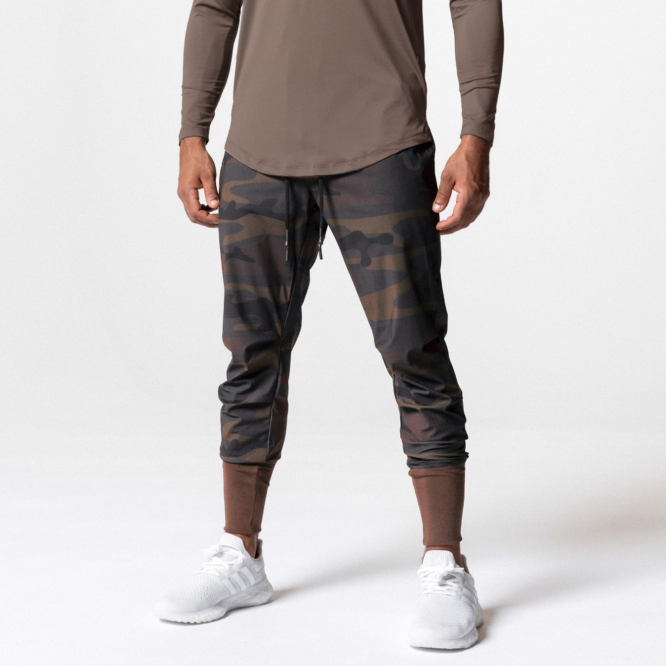 Tetra-Lite High Rib Jogger in rust camo, front view worn by model with white sneakers