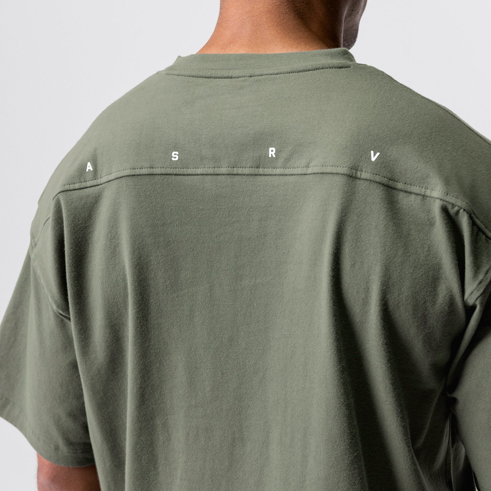 CottonPlus™ Oversized Tee in olive worn by model, back view showing seam detail