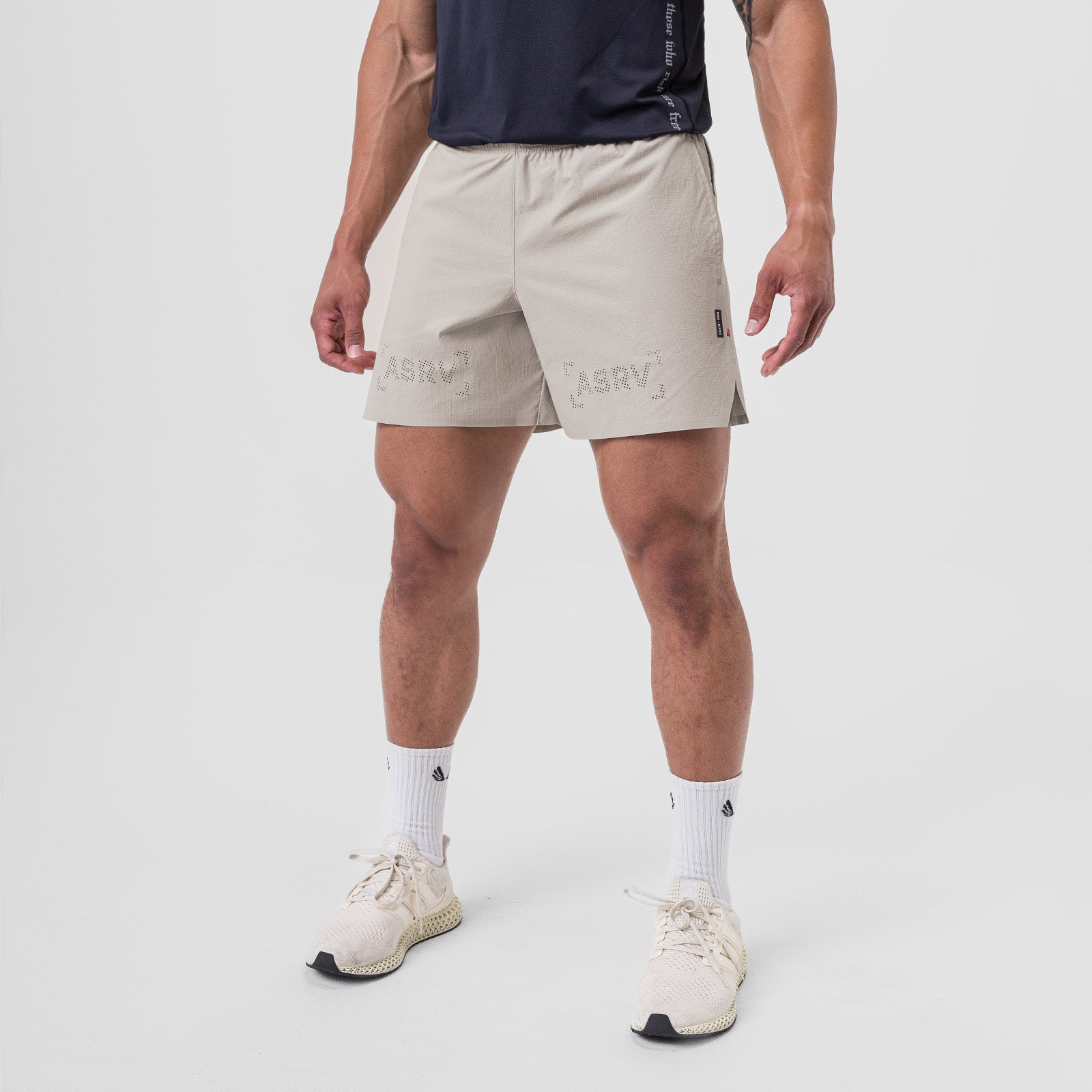Ripstop 6" Perforated Short in chai, modeled front view with white socks and sneakers