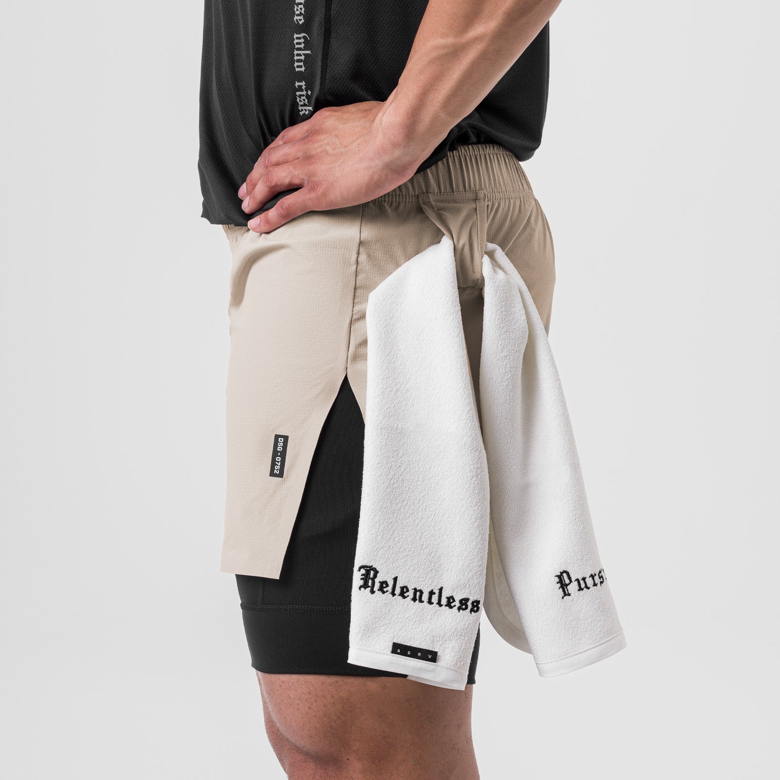 Ripstop 3" High Split Liner Short in Chai/Black worn by model, side view with towel