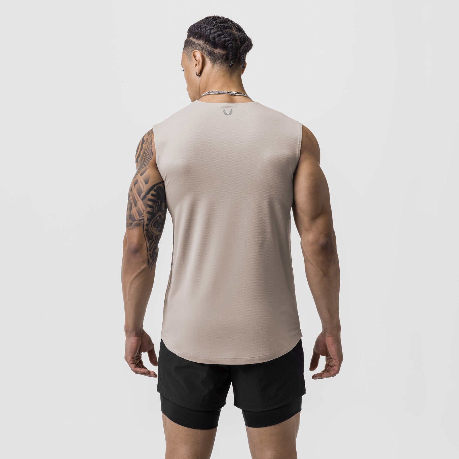 AeroSilver Cutoff Tank in chai, worn by model from back view