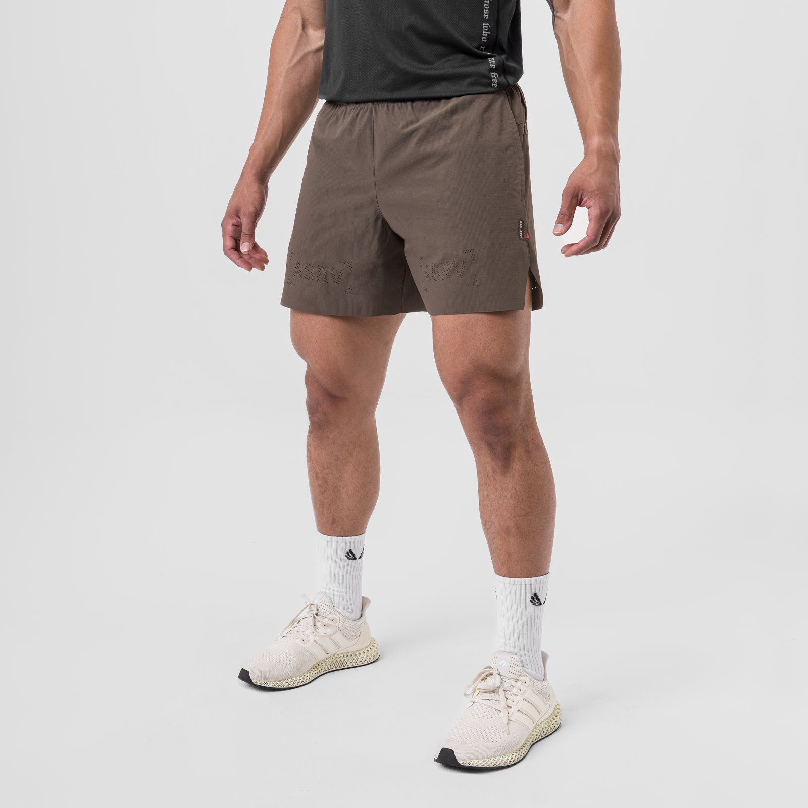 Ripstop 6" Perforated Short in Deep Taupe, modeled with white socks and cream sneakers
