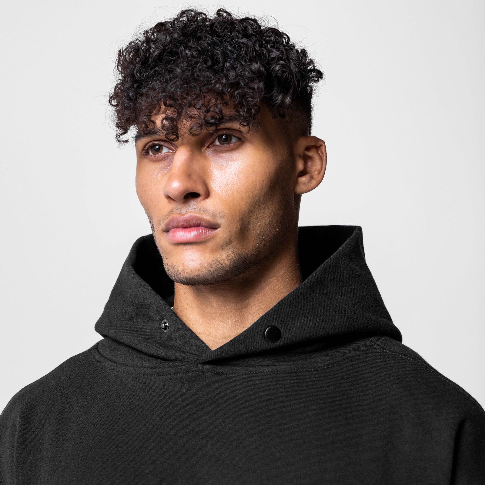 Black Tech-Terry Hoodie worn by model, front view