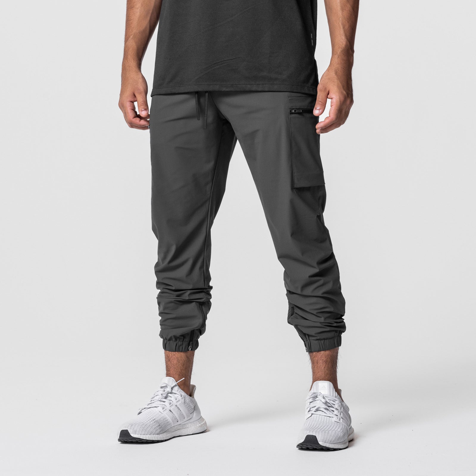 Tetra-Lite Standard Zip Jogger in space grey, modeled from waist down with white sneakers