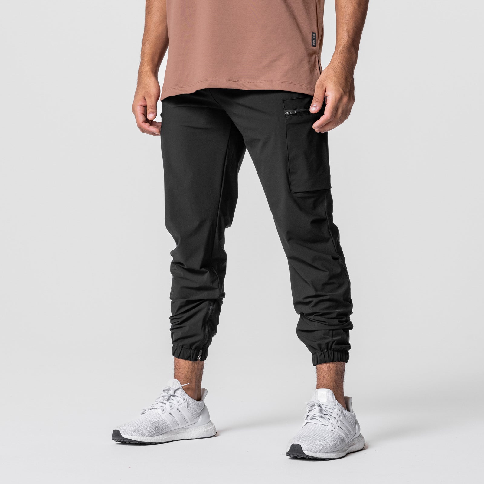 Tetra-Lite Standard Zip Jogger in black, worn by model with white sneakers