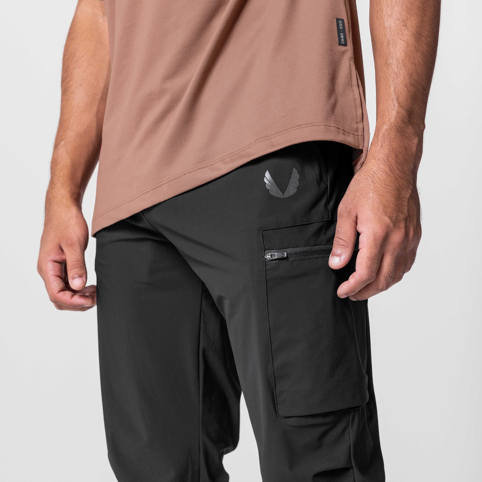 Tetra-Lite Standard Zip Jogger in black, worn with tan shirt, side view