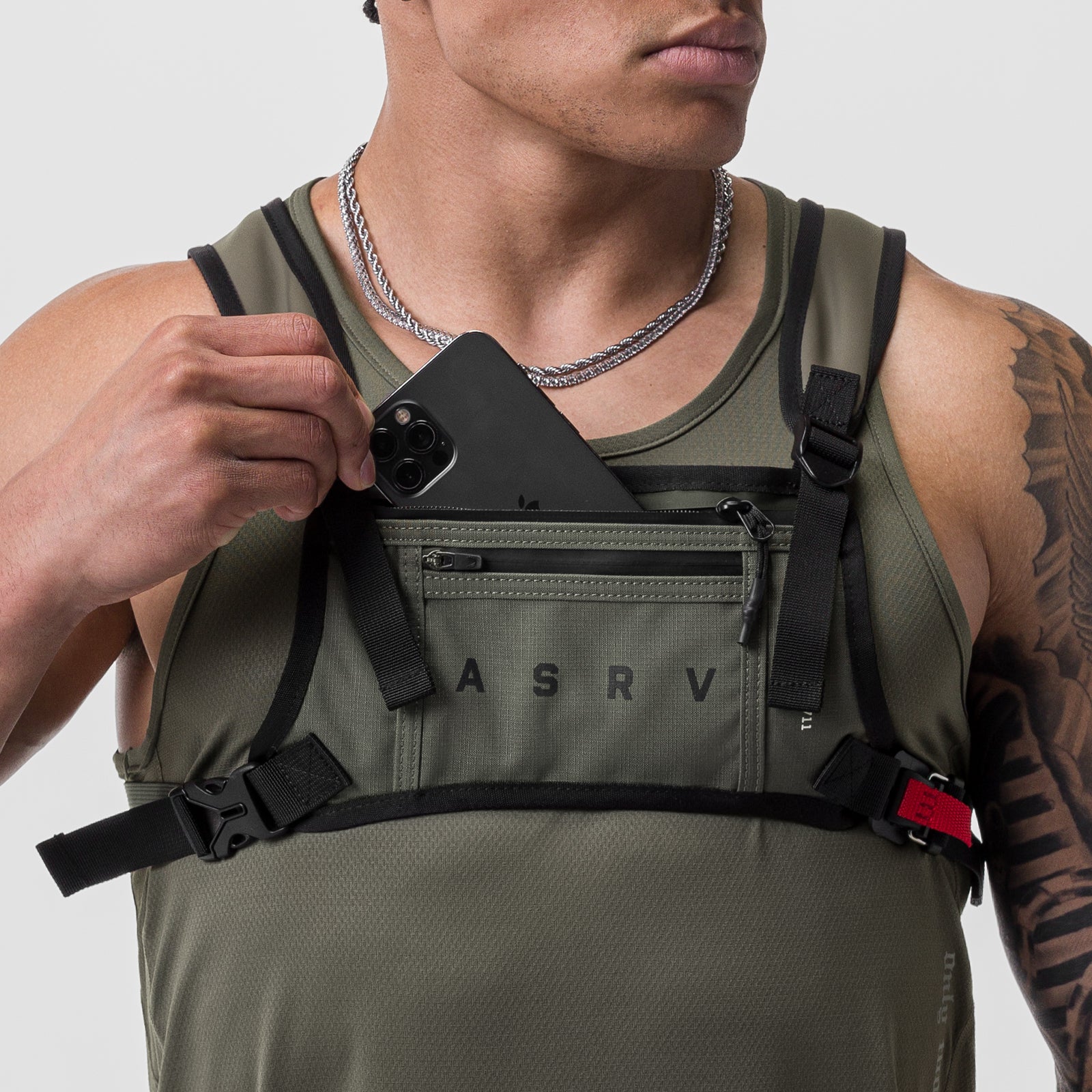 0711 Cordura® Lightweight Chest Pack in olive, worn by model displaying phone pocket