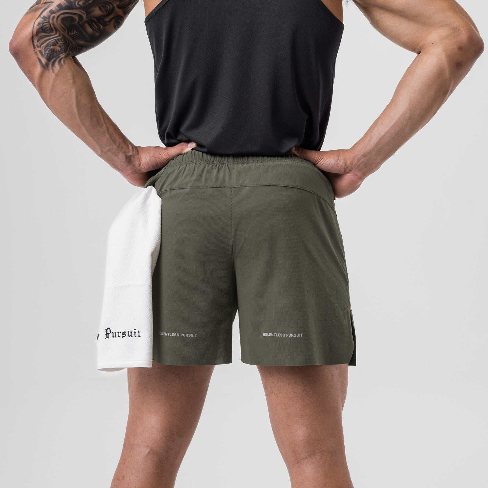 Ripstop 6" Perforated Short in olive with white underlay, back view on model