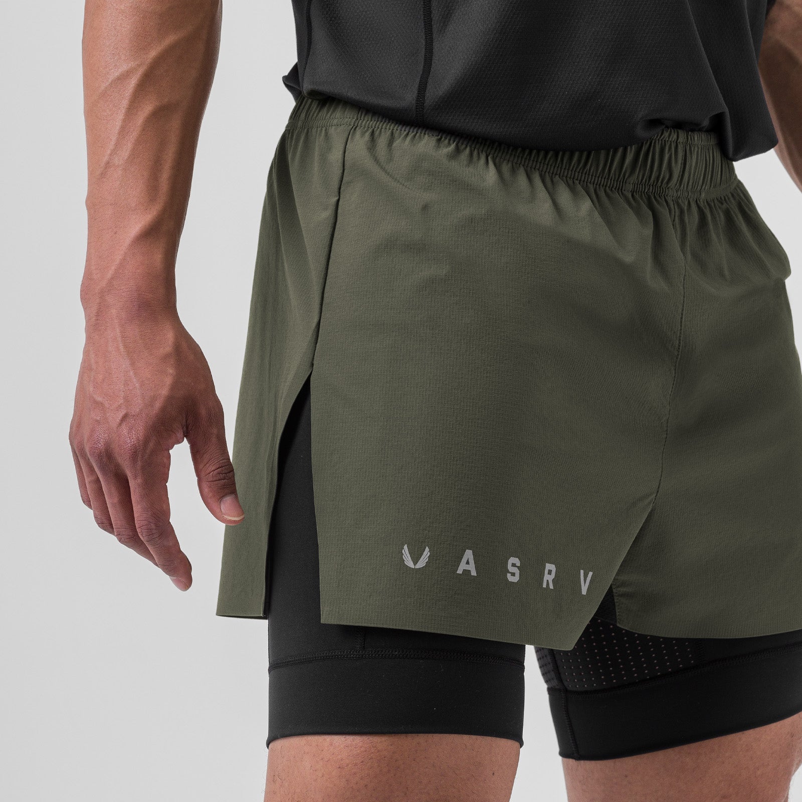 Ripstop 3" High Split Liner Short in olive and black, worn by model, side view