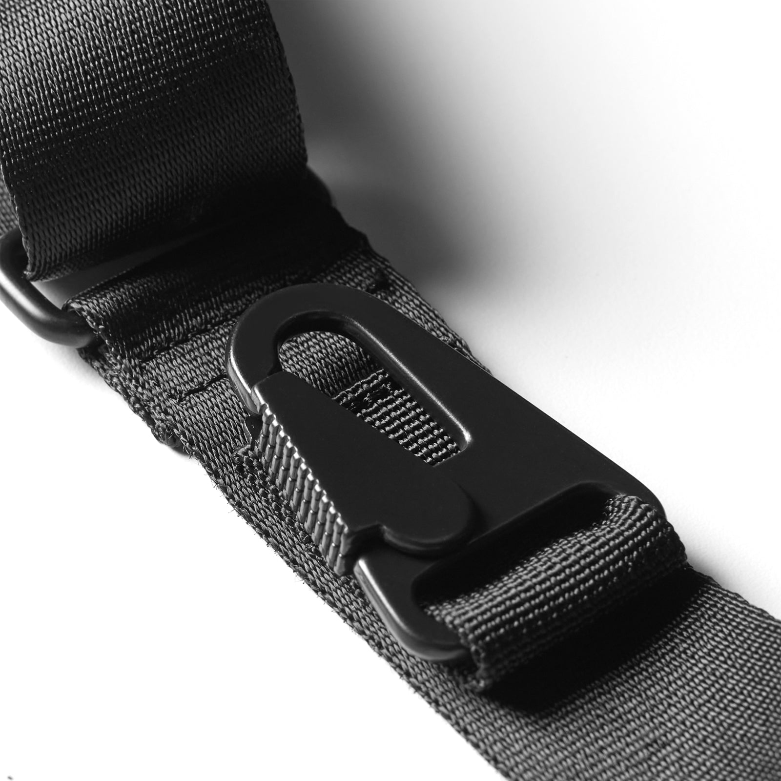 Waterproof phone holster bag in black, close-up detail of buckle and strap