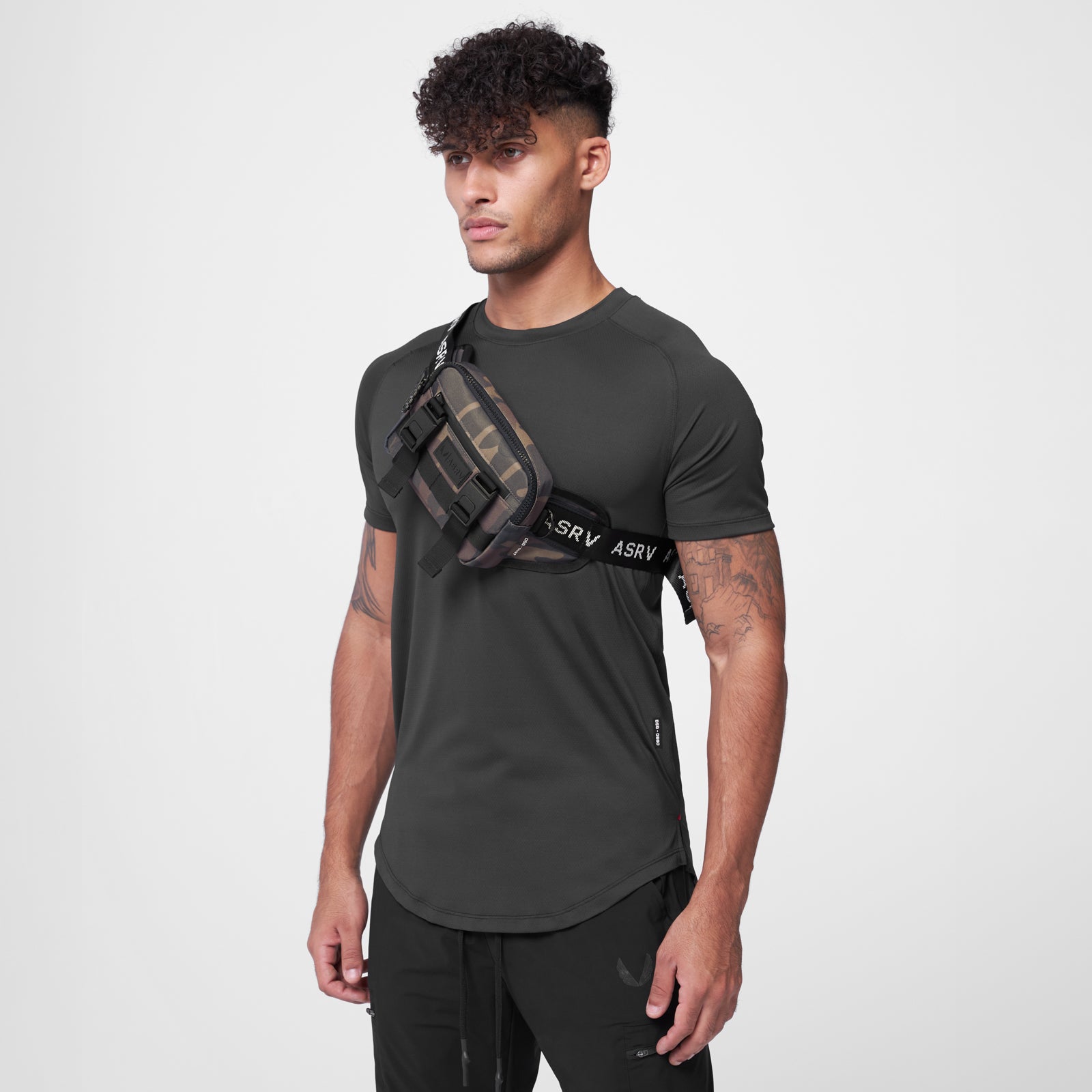 Small Crossbody Bag in Rust Camo worn across chest on model, front view