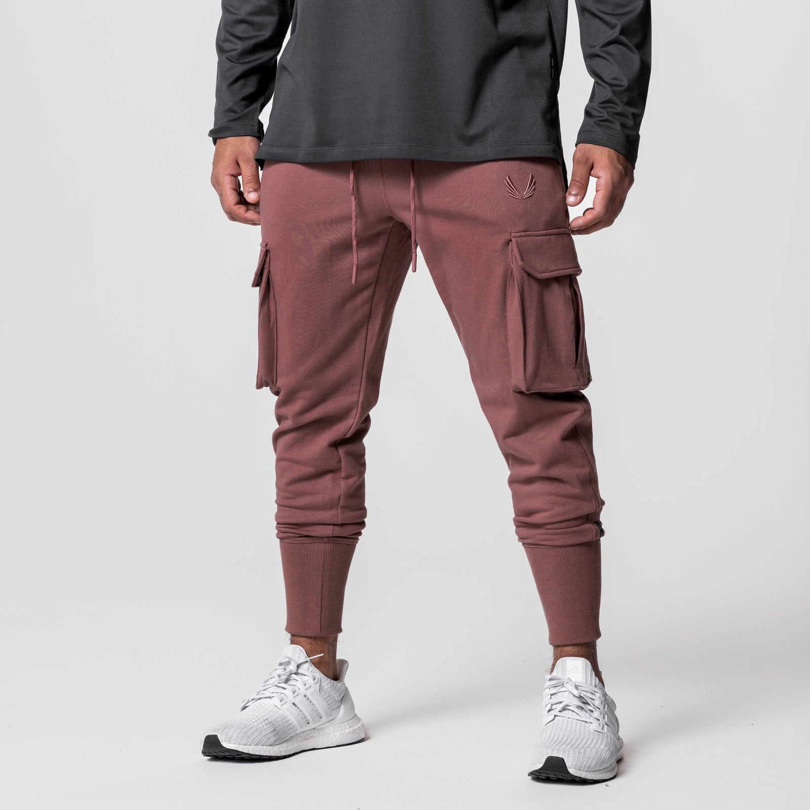 Tech-Terry Cargo High Rib Jogger in Red Earth, modeled with white sneakers