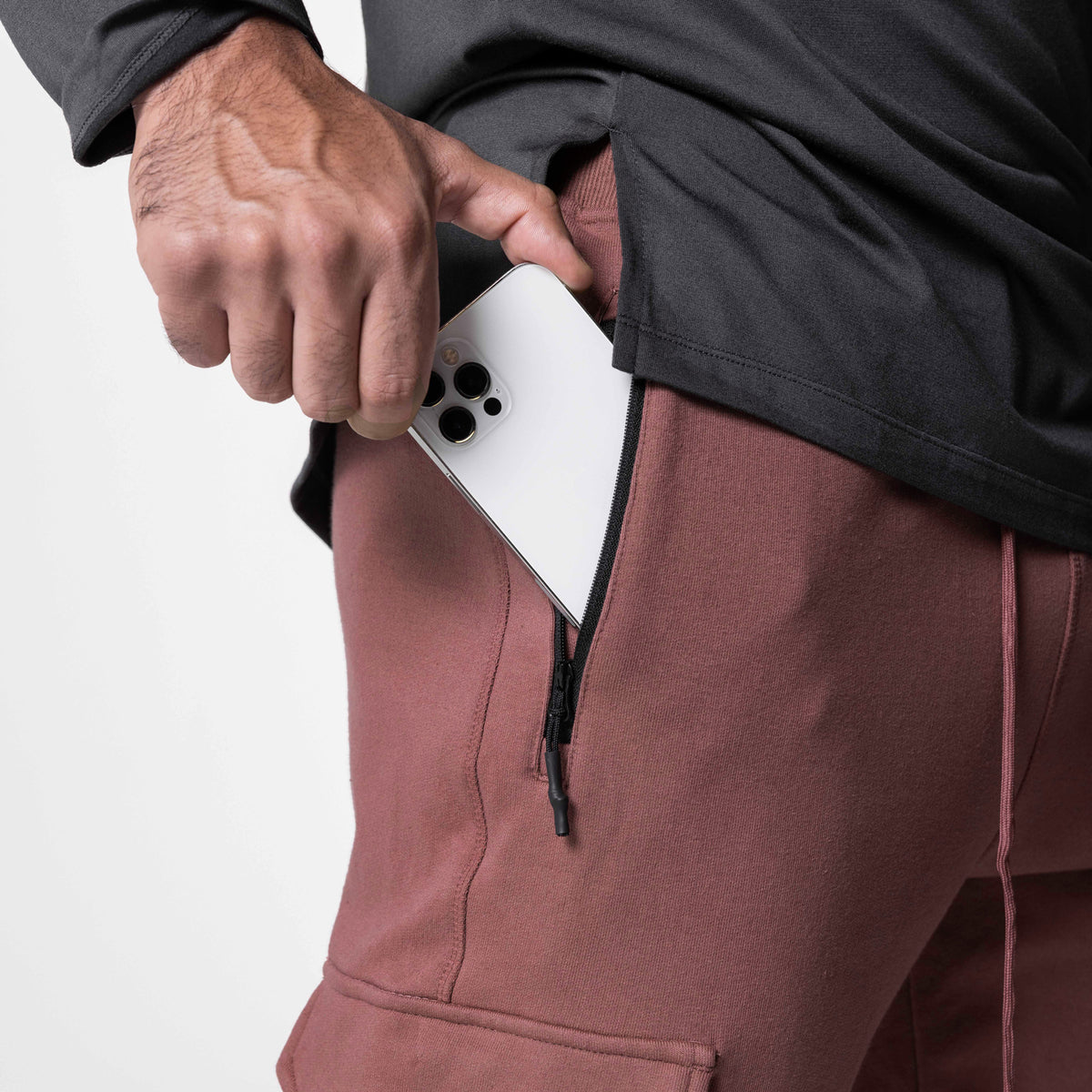 Tech-Terry Cargo High Rib Jogger in Red Earth, worn with white phone in pocket