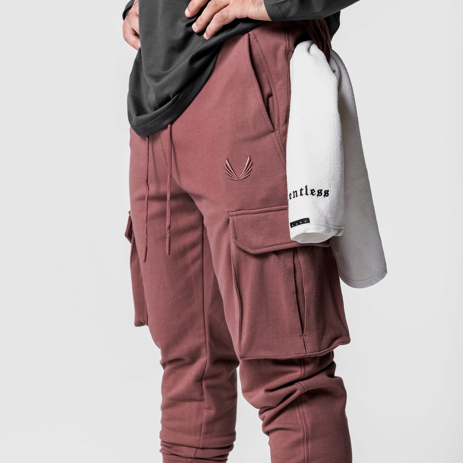 Tech-Terry Cargo High Rib Jogger in red earth, worn by model with layered clothing