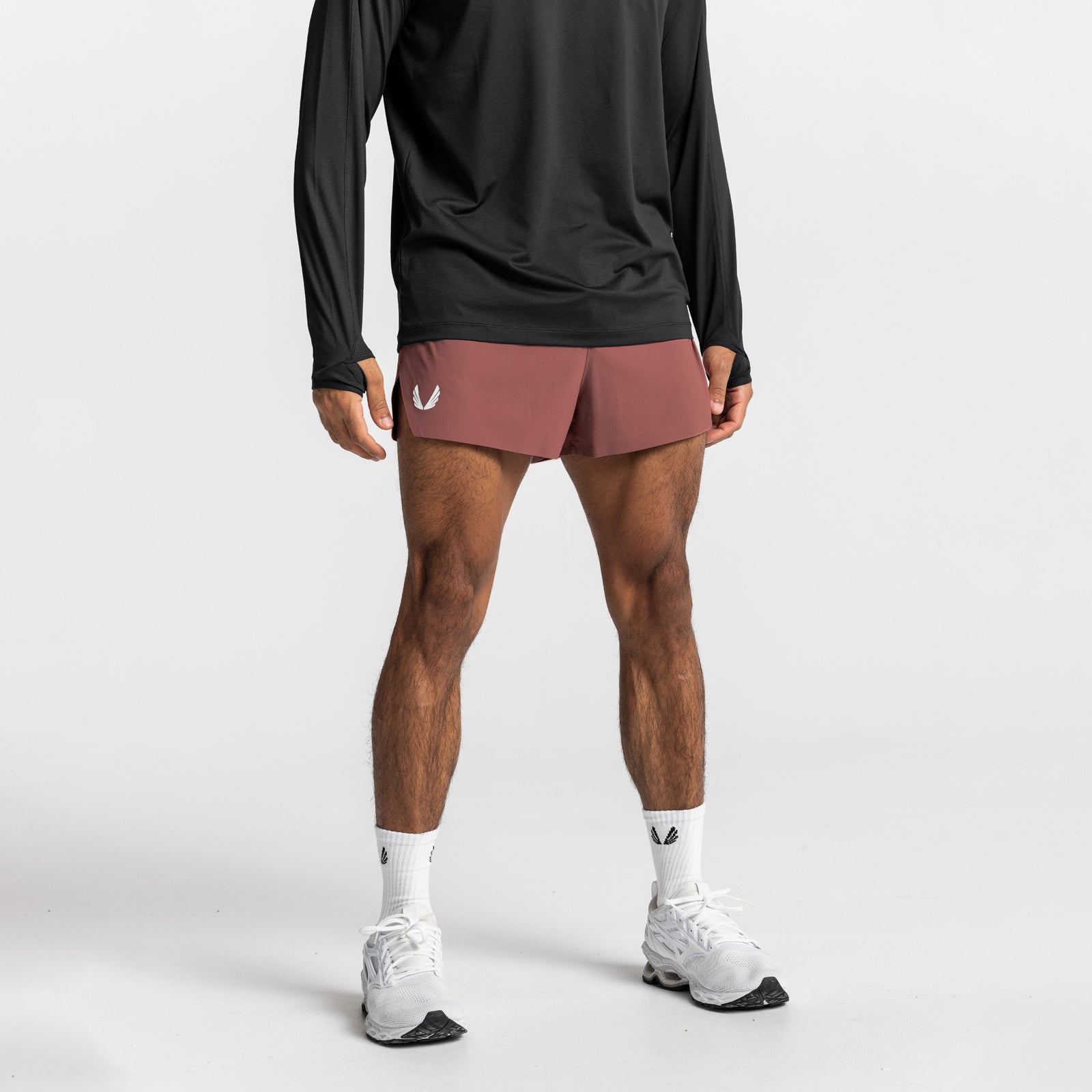 Tetra-Lite Laser Cut 3" Short in Canyon Rose, worn with black long-sleeve top and white sneakers