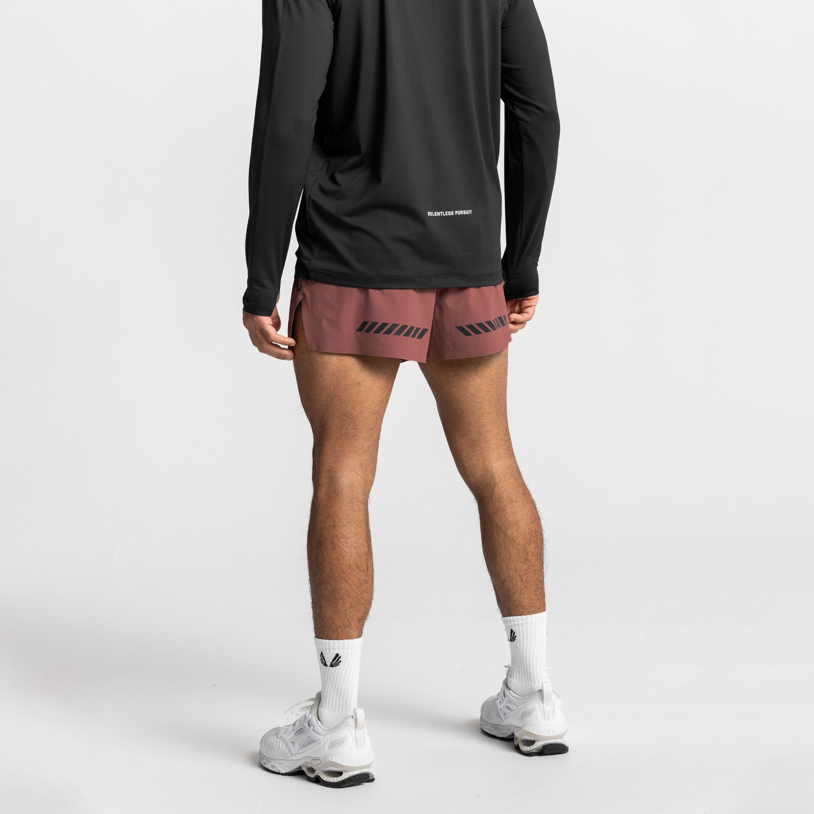 Tetra-Lite Laser Cut 3" Short in Canyon Rose, worn with black long-sleeve top and white socks