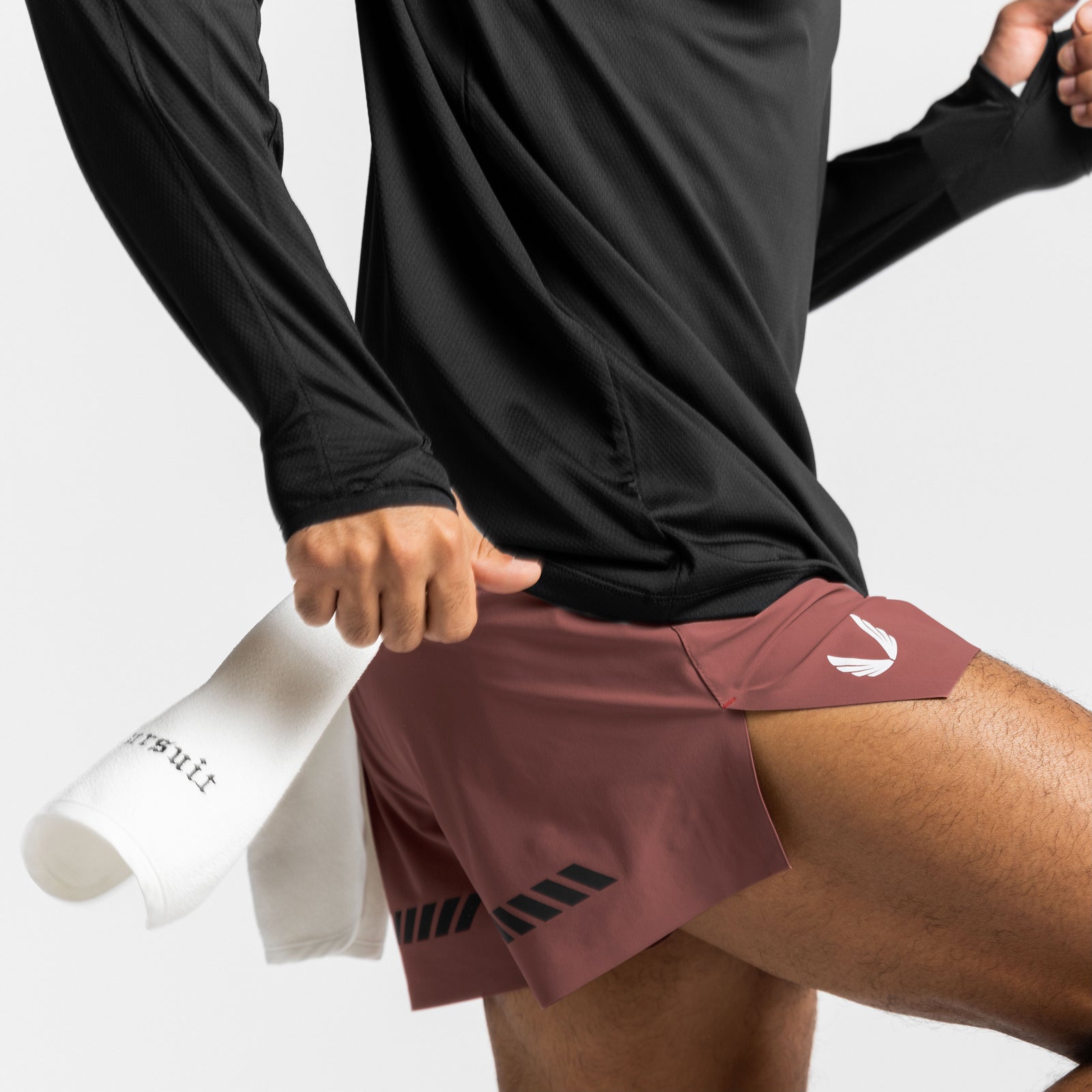 Tetra-Lite Laser Cut 3" Short in Canyon Rose, worn with black long sleeve shirt and white socks