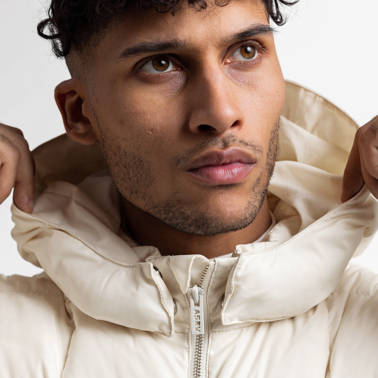 Weather-Ready Down Puffer Jacket in ivory cream worn by model, front view