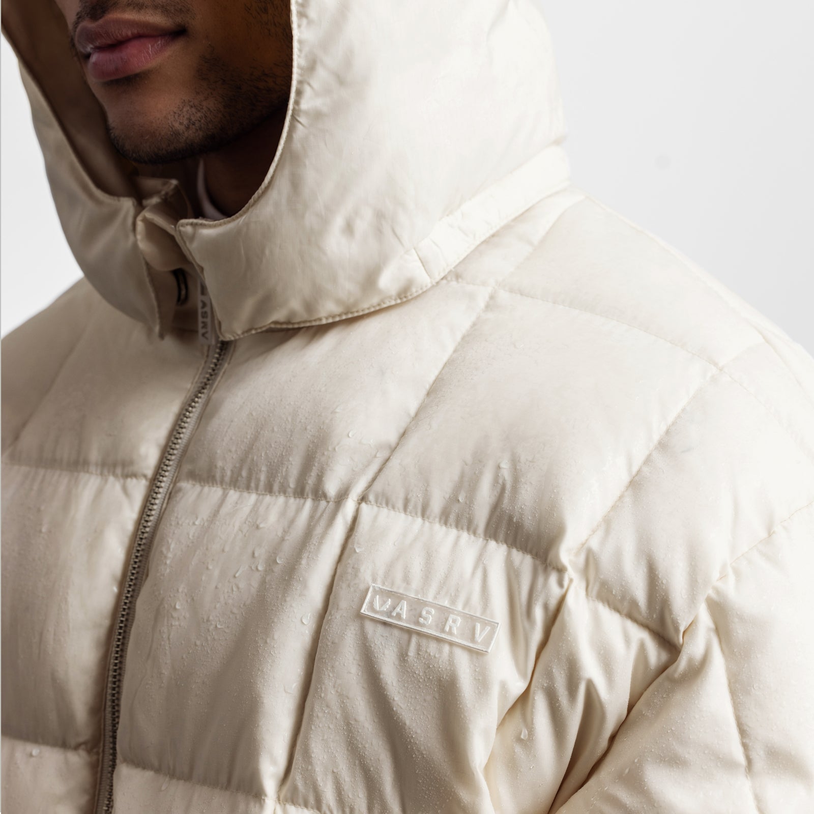 Weather-Ready Down Puffer Jacket in ivory cream worn by model, front detail view