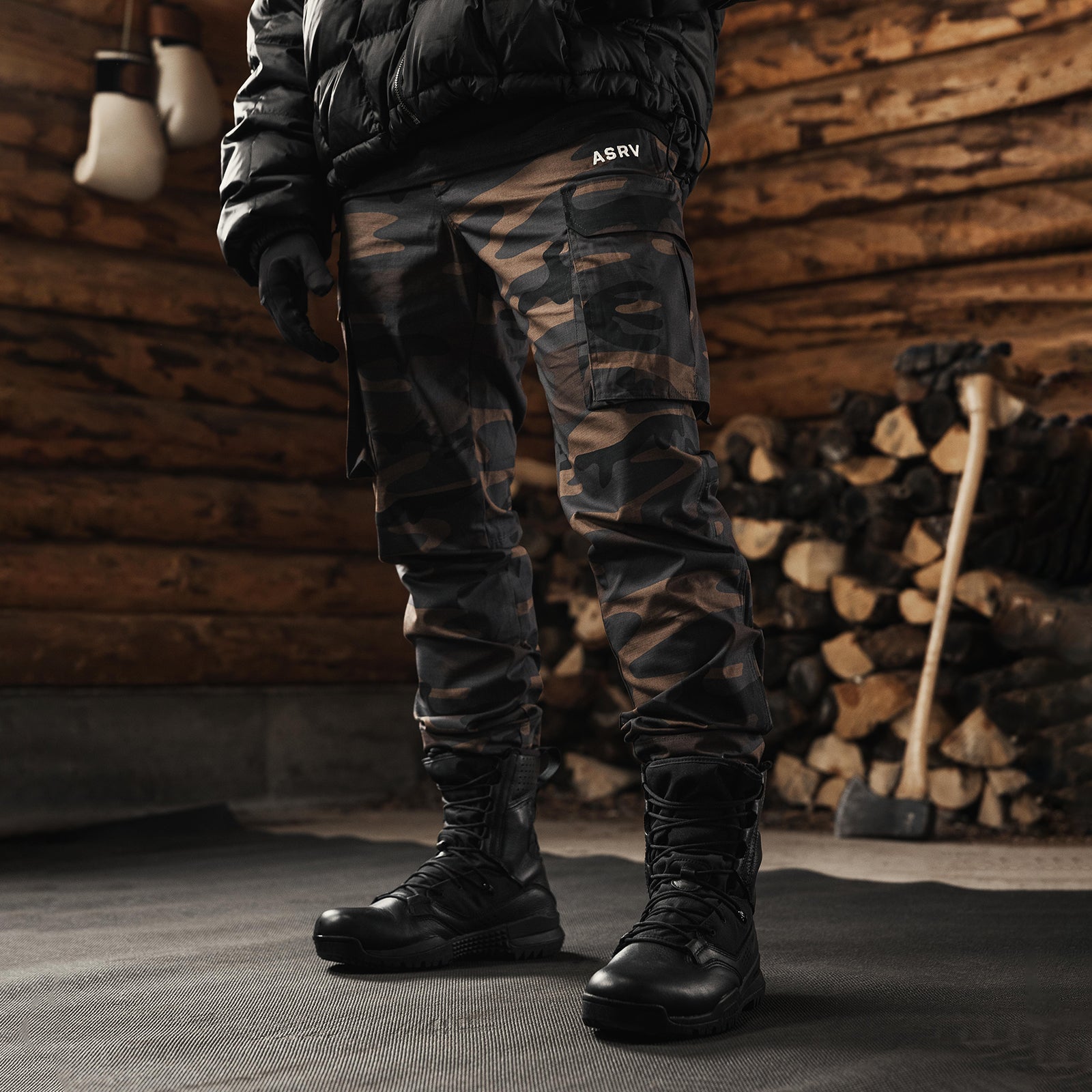 Weather-Ready Technical Cargo Pant in rust camo, worn by model with black boots, front view