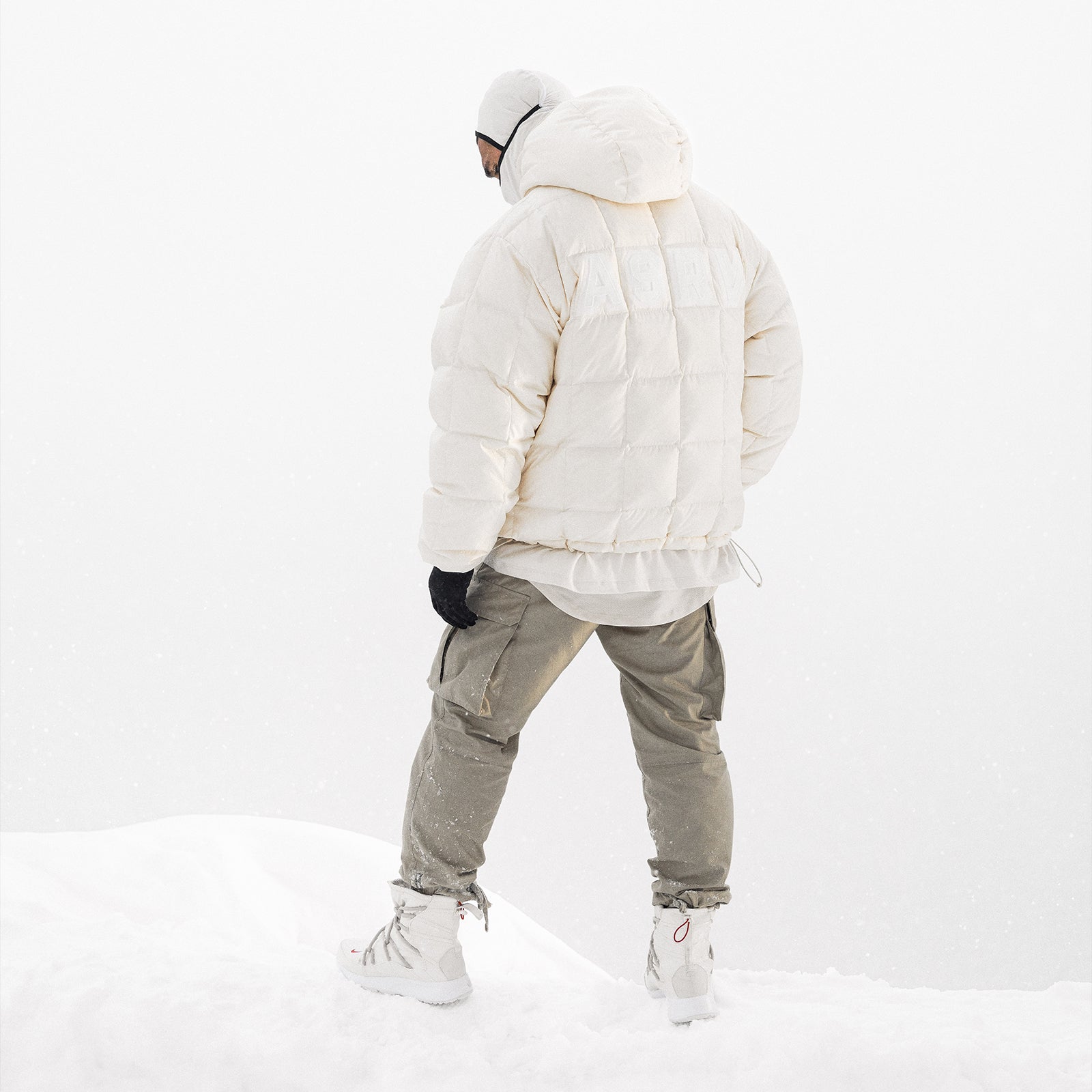 Weather-Ready Down Puffer Jacket in ivory cream, worn by model from behind in snowy setting