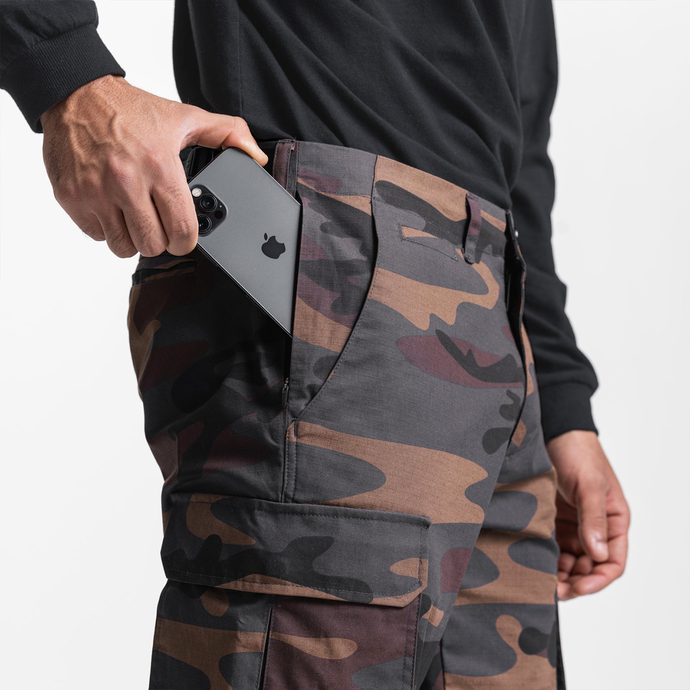 Weather-Ready Technical Cargo Pant in rust camo worn by model holding phone in pocket