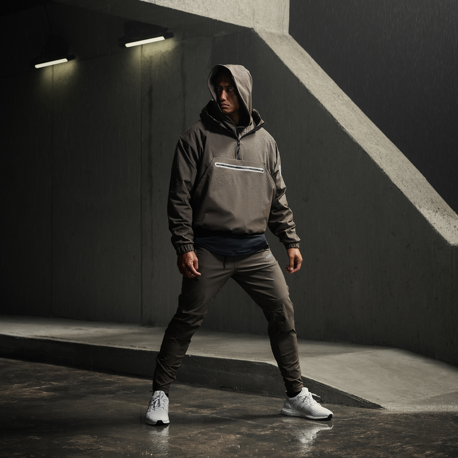 Weather-Ready Anorak Jacket in deep taupe, worn by model in wide stance pose